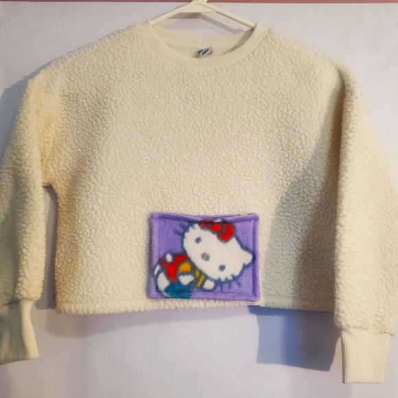 Old Navy Other - Hello Kitty Pocket on White Fleece Old Navy Sweater, Girls Medium size 8